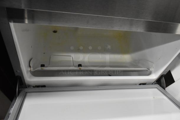 Hoshizaki F-330BAH-C stainless steel ice machine interior, shows clean storage compartment, self-contained, 115V, 1 phase.