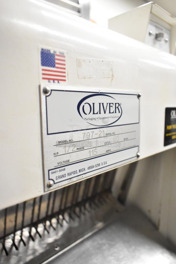 Oliver 797-21 Metal Bread Loaf Slicer, 115V, 1 Phase. Label shows model details and USA flag. Good condition.