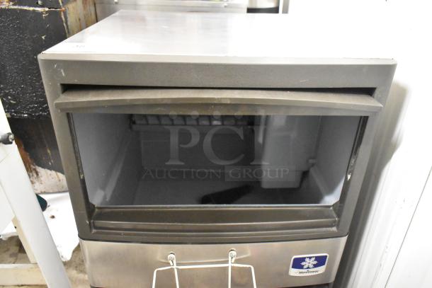 Manitowoc QM45A Stainless Steel Undercounter Ice Machine, self-contained, 115V, 1 Phase, tag visible, good condition.