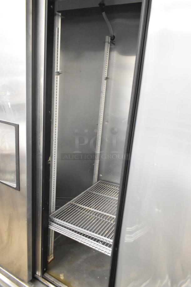 2017 True T-35 stainless steel commercial 2-door reach-in cooler, poly-coated racks, 115 volts, 1 phase, interior view.