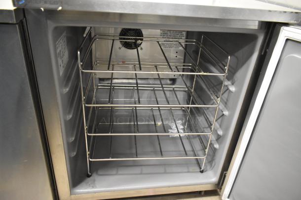 2021 Delfield 406P-STAR4 stainless steel single door undercounter cooler with wire shelving and commercial casters.