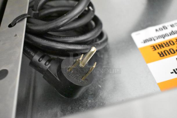 Plug and label of a 2021 Delfield 406P-STAR4 stainless steel commercial undercounter cooler, 115 volts, 1 phase.