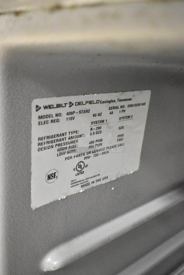 2020 Delfield 406P-STAR4 stainless steel undercounter cooler, 115V, model and refrigerant details visible on label.