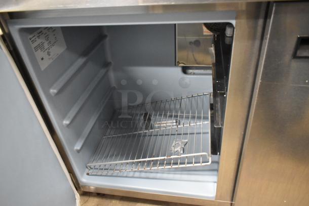 Delfield UC4048-STAR undercounter cooler, stainless steel, two doors, open interior with shelf, 115V, commercial model.