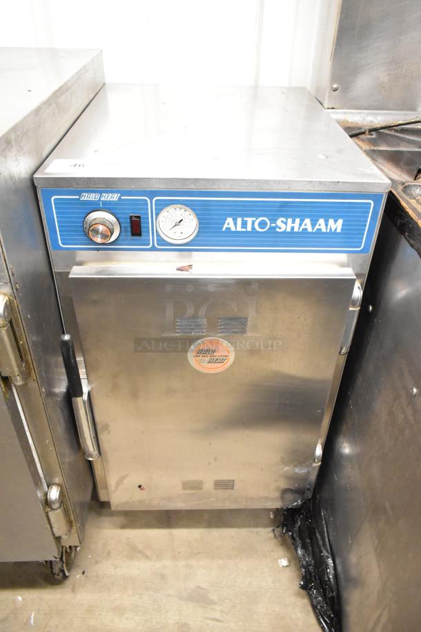 Alto Shaam 500-S stainless steel heated holding cabinet, 125V, on commercial casters. Features temperature gauge and control knob.