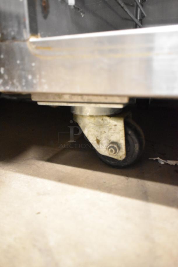 Alto Shaam 500-S stainless steel heated holding cabinet on casters, 125V, 1-phase. Visible caster, shows wear.