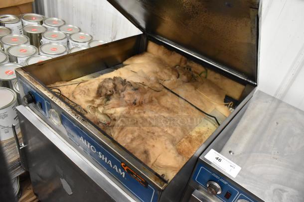 Alto Shaam 750-S Heated Holding Cabinet with open top, visible insulation, stainless steel exterior, and caster wheels.