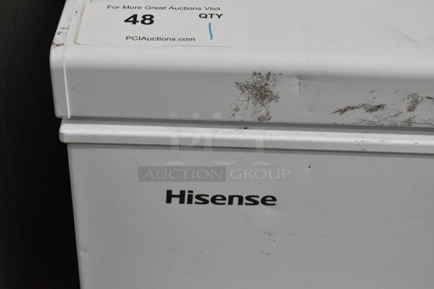 Hisense WFC050M6XWD chest freezer, hinge lid, 115 volts, visible scuffs on lid, model label shown, auction lot 48.