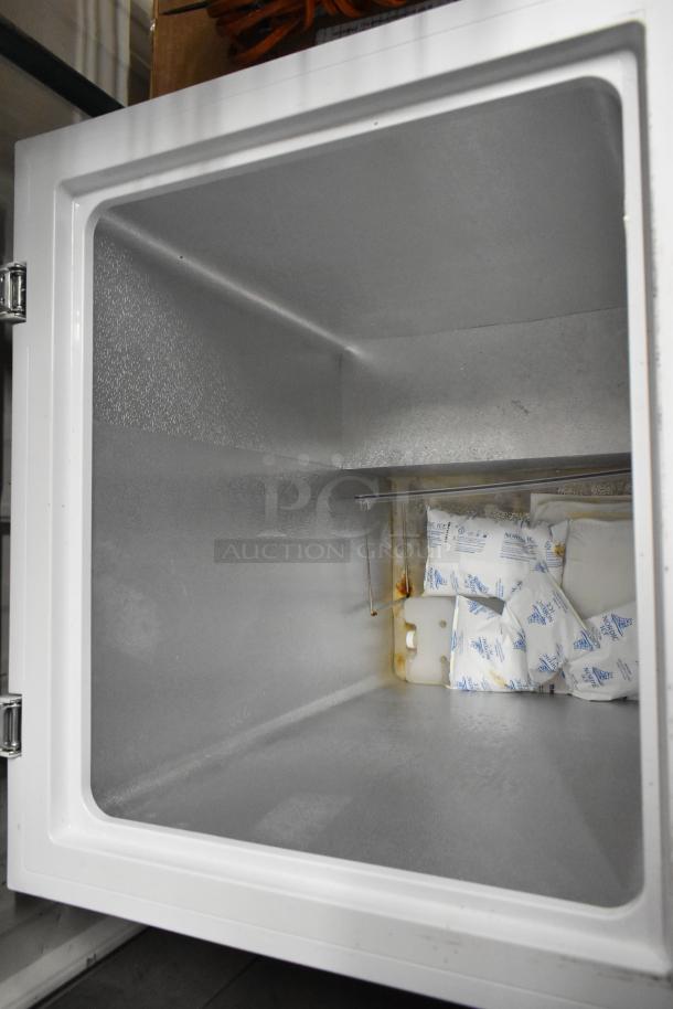 Hisense WFC050M6XWD chest freezer with hinge lid, shown open. Interior is clean, includes packaging materials. 115 Volts, 1 Phase.