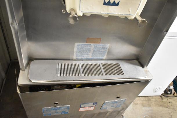 Taylor 754-27 stainless steel soft serve ice cream machine, floor style, 2 flavor with twist, on commercial casters.