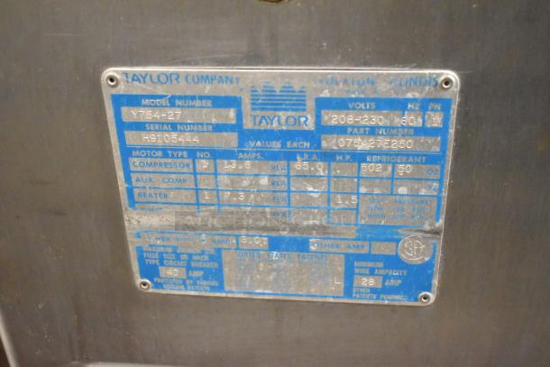 Taylor 754-27 stainless steel commercial floor ice cream machine label, showing model, serial number, power specs, and refrigeration details.