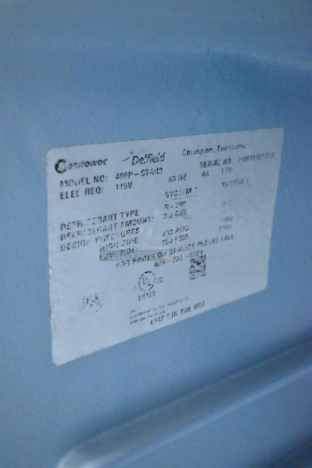 Delfield 406P-STAR2 stainless steel undercounter cooler label showing model, 115V, refrigerant type, and service info.