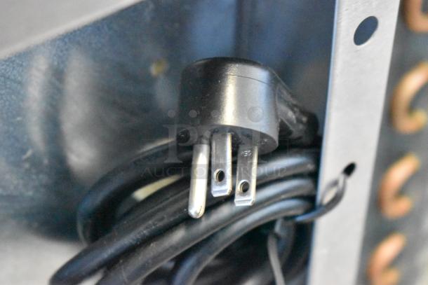 Close-up of a power plug for the 2021 Delfield 406P-STAR2 stainless steel undercounter cooler, 115 volts, 1 phase.