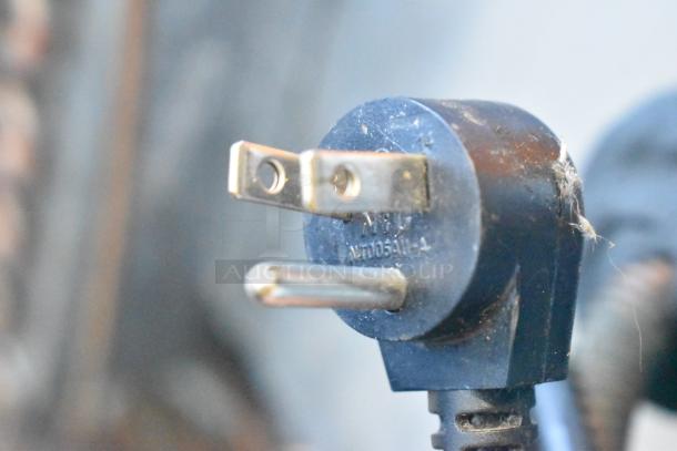 Close-up of a power plug for the Delfield 406P-STAR2 undercounter cooler, showing a three-prong 115V plug.