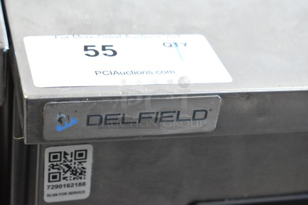 2019 Delfield 406P-STAR2 stainless steel undercounter cooler with Delfield logo and auction label visible. 115V, 1 phase.