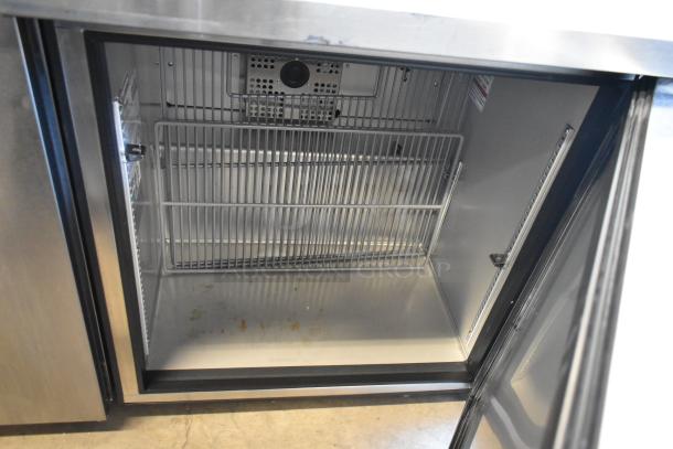 2023 True TUC-27-HC stainless steel undercounter cooler. Single door, 115 volts, 1 phase. Interior view with wire shelves.