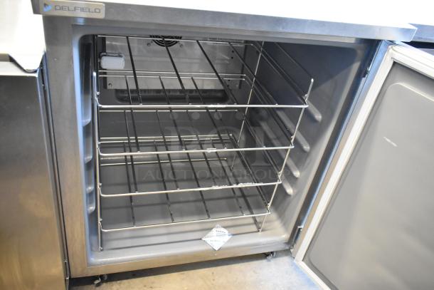 2021 Delfield 406P-STAR4 stainless steel undercounter cooler, 115V, 1 phase, single door open, shelves visible.