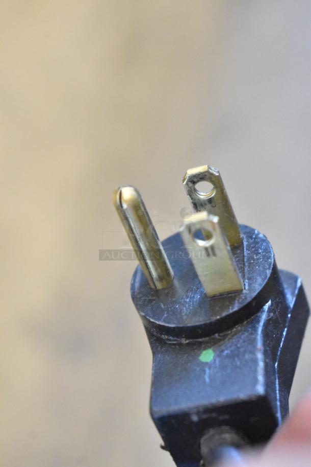 Close-up of the plug from a 2021 Delfield 406P Stainless Steel Commercial Single Door Undercounter Cooler, 115V.