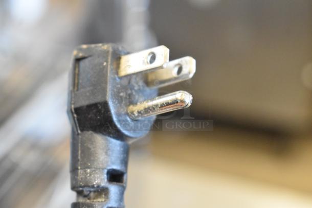 Close-up of a metal bug zapper power plug, model CEOS72/DS-225, 115 volts, 1 phase. Used condition.