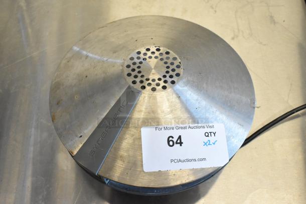 Synergetic bug zapper with metallic finish, some wear. Auction tag reads "64, QTY x2, PCIAuctions.com."