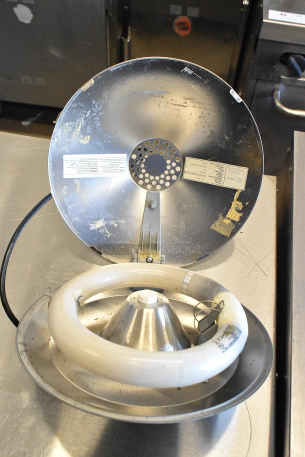 Bug Zapper and Pelsis Light Fixture in fair condition. Visible wiring and light tube, with manufacturer labels intact.