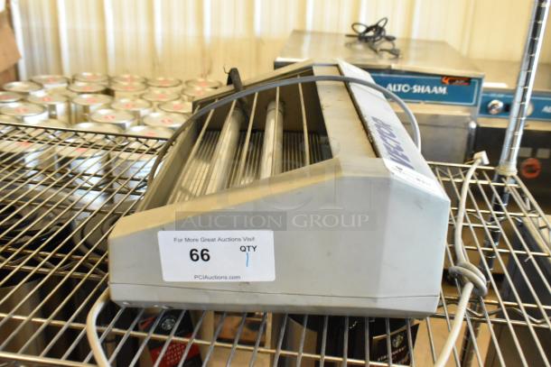 Vector 45091605 Bug Zapper, 115V, 1 Phase, used condition. Features grills and wiring. Auction tag indicates quantity 1.