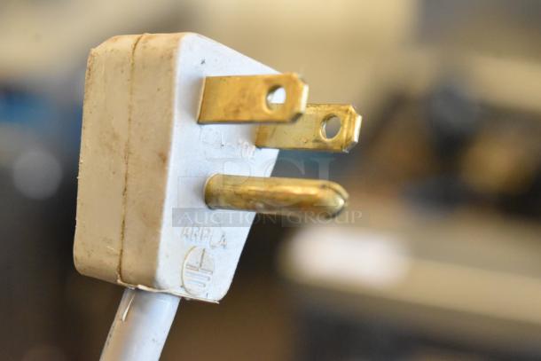 Close-up of power plug for Vector 45091605 Bug Zapper. Shows three-pronged connector, slight wear visible. Model uses 115 Volts, 1 Phase.