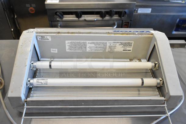 Vector 45091605 Bug Zapper, 115V, 1 Phase, dual tube design, visible wear, pest control device with labels and model info.