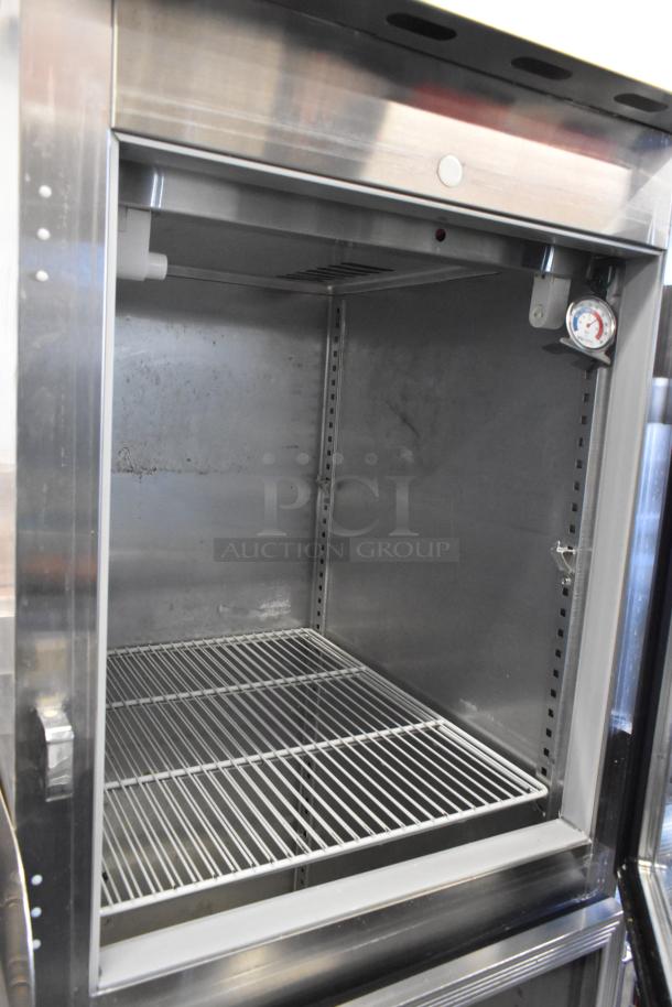 Victory VR-SA-1D-HG stainless steel cooler, two half-size doors, on casters. Features shelves and temperature gauge.