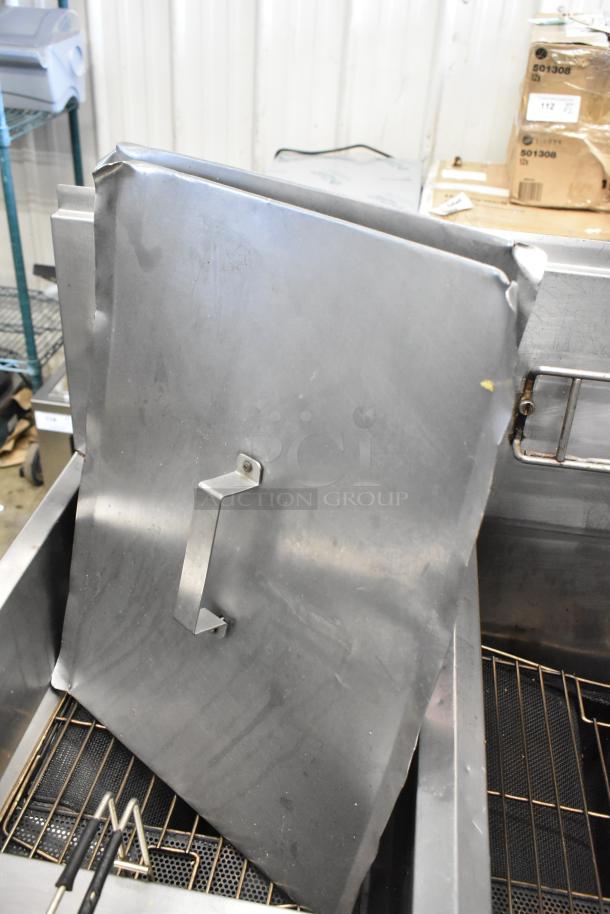 Frymaster PH255SC stainless steel natural gas deep fryer with lid on commercial casters, 80,000 BTU, visible wear.