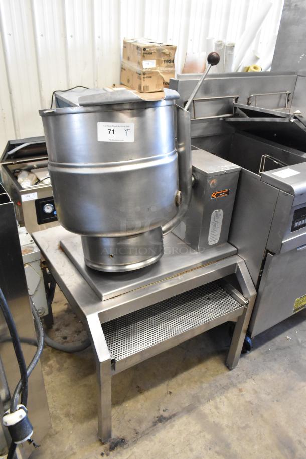 Groen stainless steel commercial electric steam kettle, 208/240 volts, mounted on a stand, in good condition, item tag visible.