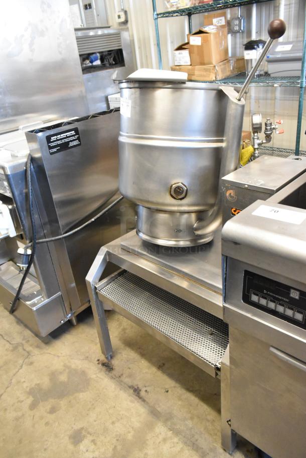 Groen stainless steel commercial steam kettle, electric powered, 208/240 volts, used condition, visible labels, mounted on a stand.
