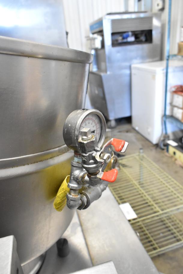 Groen stainless steel commercial steam kettle, electric-powered, 208/240 volts, with pressure gauge and red lever.