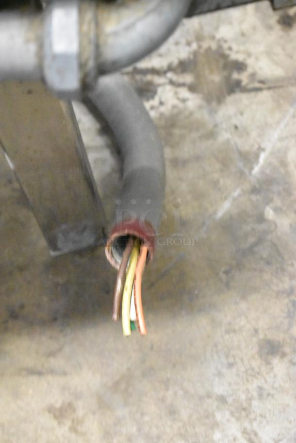 Groen stainless steel commercial electric steam kettle, showing power cable and connector. 208/240 volts.