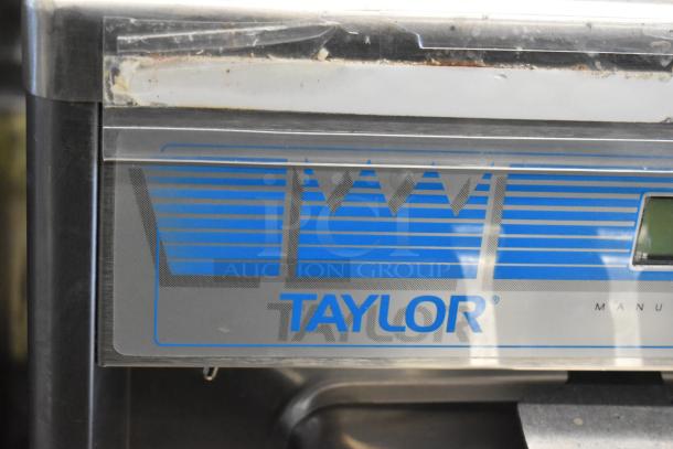 Taylor 337-27 stainless steel soft serve machine, air-cooled, 2-flavor with twist, countertop model. Visible Taylor logo.