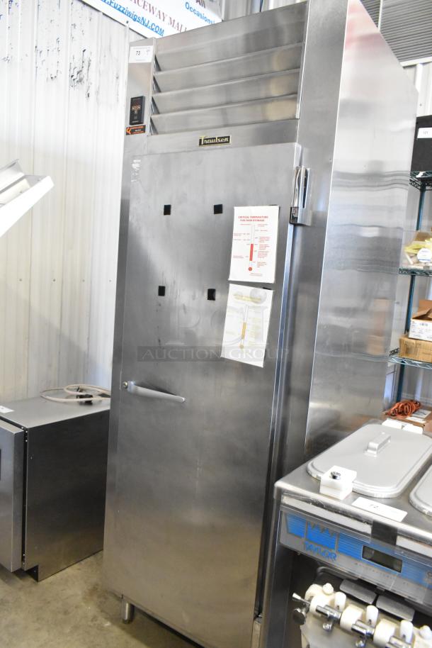 Traulsen RHT132WUT-FHS stainless steel commercial single door reach-in cooler, 115 volts, 1 phase, with temperature guide.