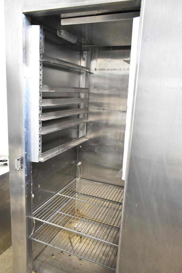 Traulsen RHT132WUT-FHS stainless steel single door reach-in cooler, 115V, 1 phase, commercial grade, shelves visible.