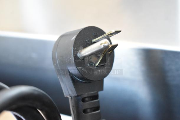 Close-up of a black electrical plug for a 2020 Delfield 406P-STAR2 undercounter cooler, 115 Volts, 1 Phase.