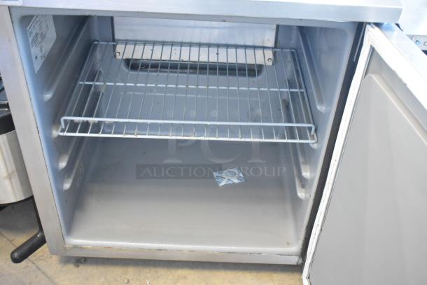 2020 Delfield 406P-STAR2 stainless steel undercounter cooler, single door, 115V, shown open with wire shelf.