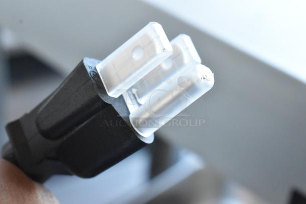 "Close-up of a Hatco GRFFL Countertop Warmer plug. 120V, 1 Phase. New condition with minor scratches."