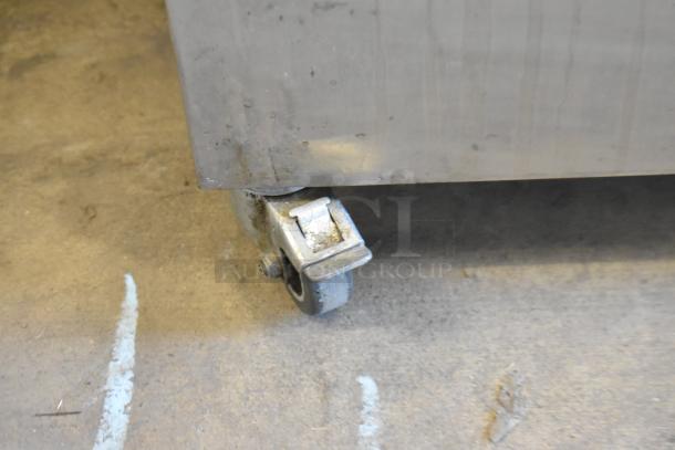 Jun-Air 87R-4MN1-HSBHH Nitrogen Generator with stainless steel body on commercial casters. Visible caster detail.