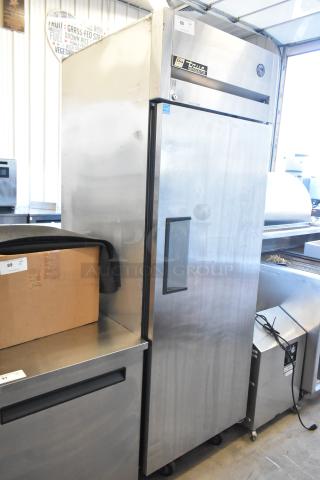 True TG1R-1S stainless steel single door reach-in cooler with poly-coated racks on commercial casters, 115V, 1 phase.