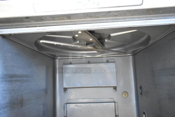 2020 Hobart LXER stainless steel commercial undercounter dishwasher interior, showing spray arm and stainless finish.