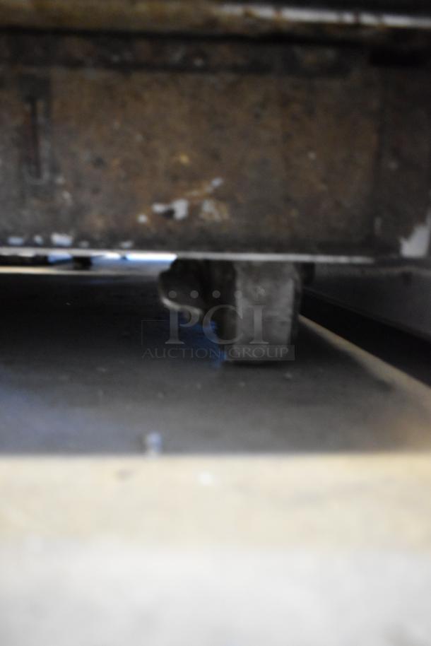 Hatco CS2-10 Chef System S2 commercial oven on casters, stainless steel, 240V, 1 phase, focusing on a caster wheel.