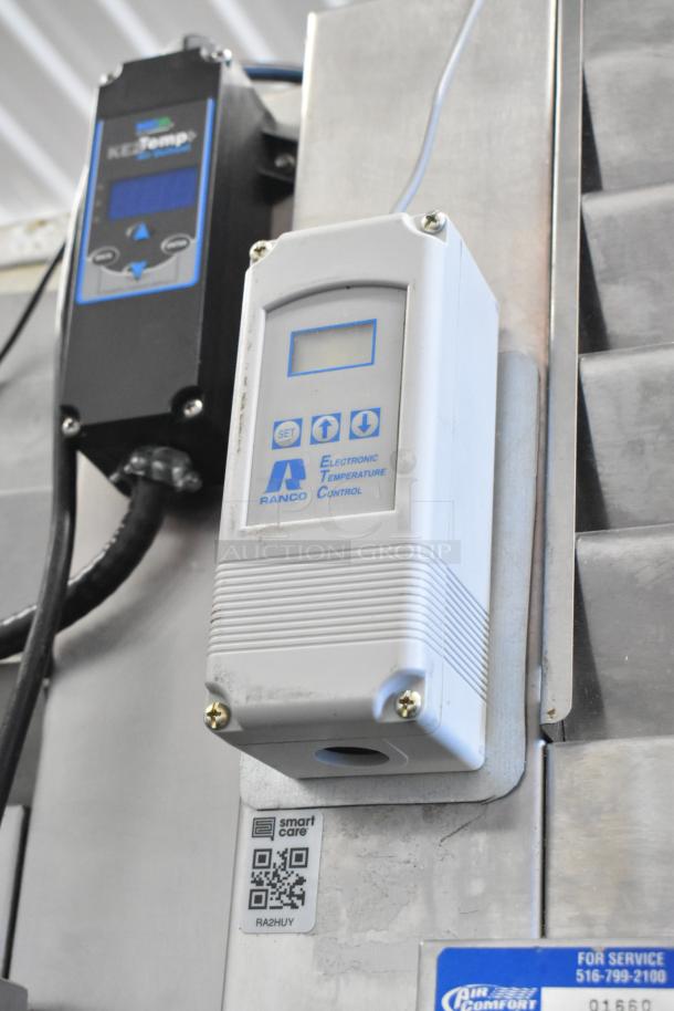 Traulsen RHT132WREHHS stainless steel cooler with electronic temperature control, metal racks, 115V, showing labels and QR code.