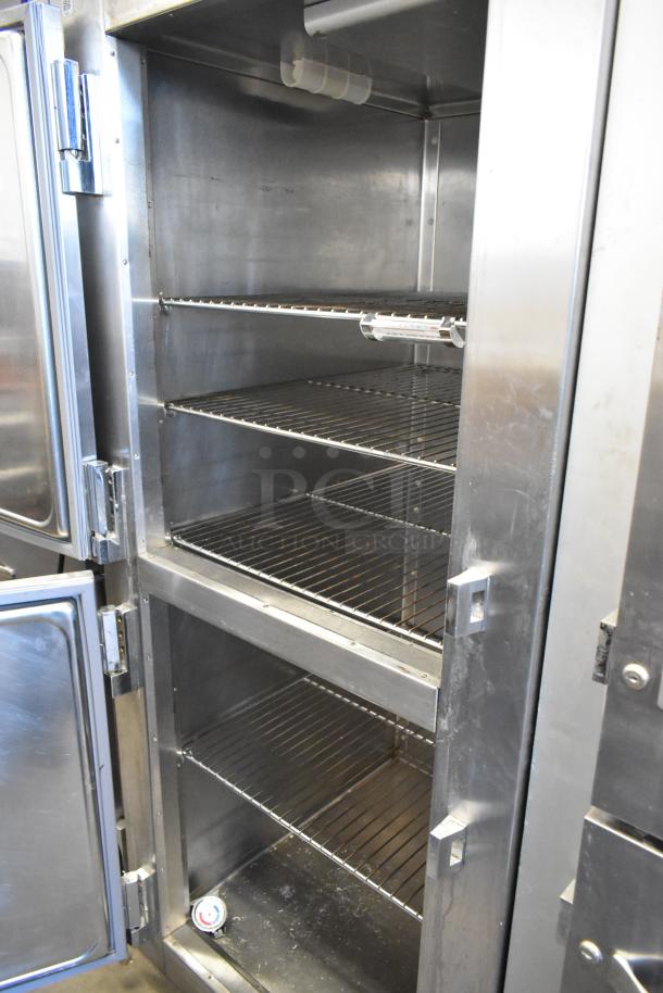 Traulsen RHT132WREHHS stainless steel commercial cooler with 2 half-size doors and metal racks. 115V, 1 phase.