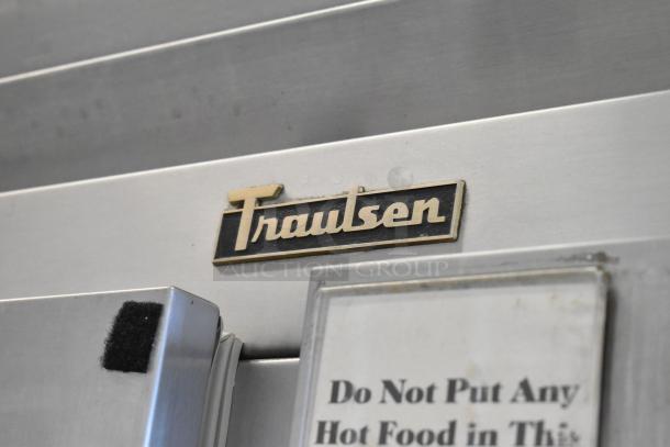 Traulsen RHT 2-32NUT stainless steel commercial cooler label, featuring four half-size doors, metal racks, commercial casters. 115 volts.