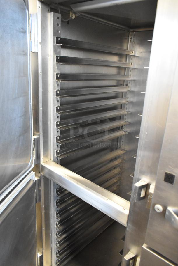 Traulsen RHT 2-32NUT stainless steel reach-in cooler, 4 half doors, metal racks, on casters, 115V, 1 phase.