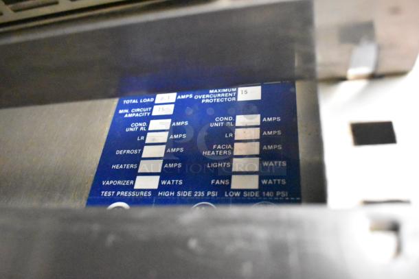 Traulsen RHT 2-32NUT control panel showing amperage and test pressures for commercial cooler.