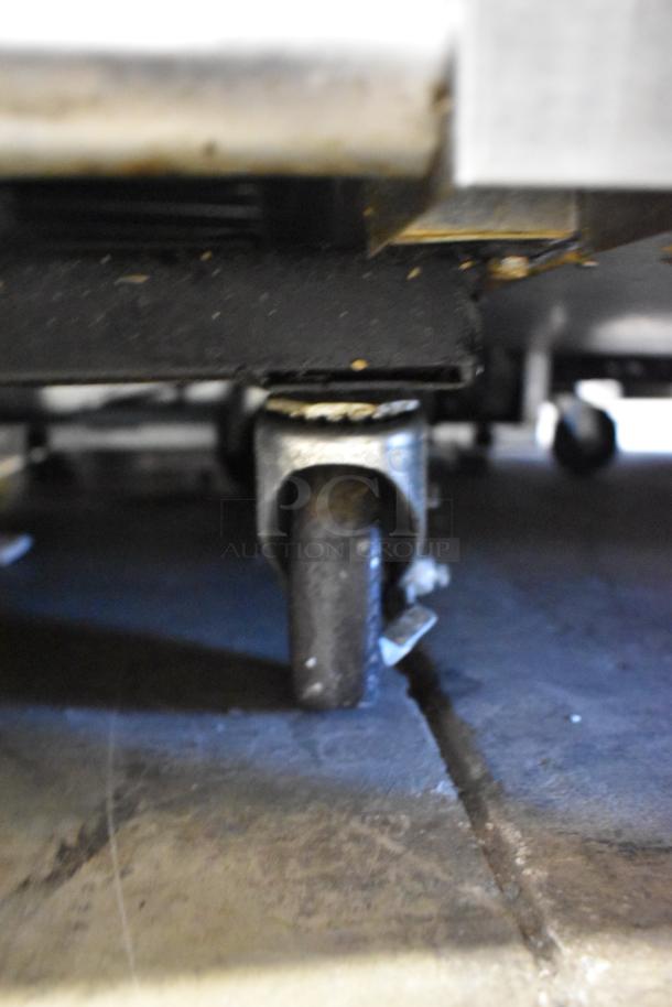 2021 True T-49DT-4-HC freezer caster wheel, displaying commercial mobility and structural support.